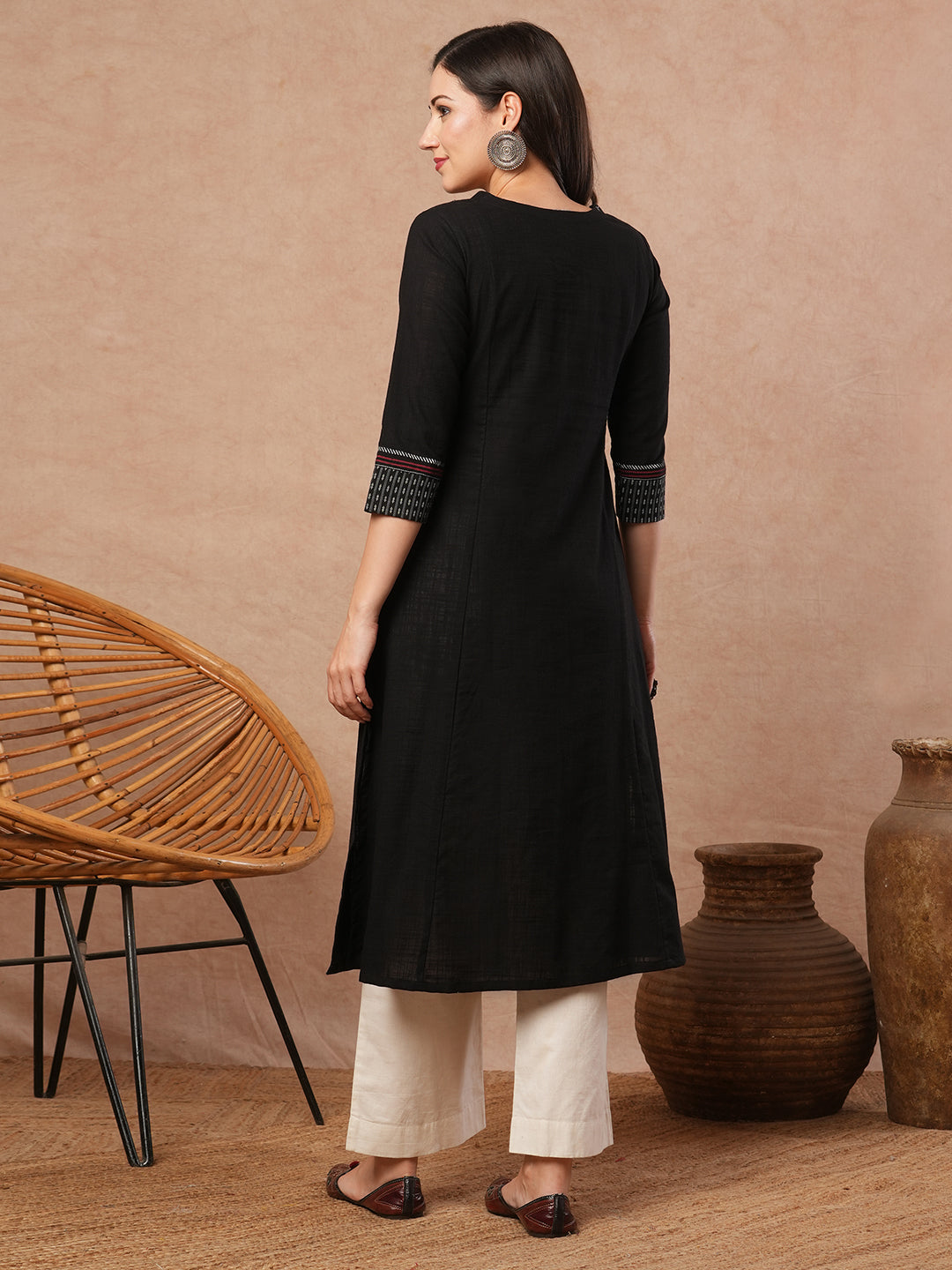 Pocketed A-line kurta in cotton slurb fabric with block print and handwork detailing.