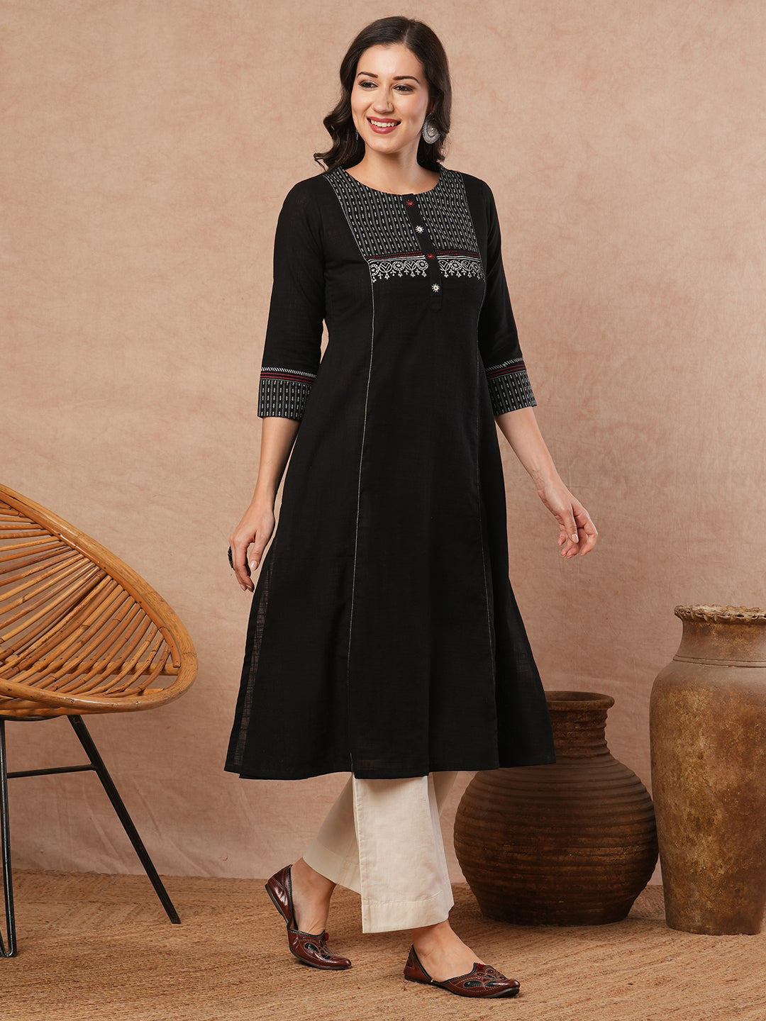 Pocketed A-line kurta in cotton slurb fabric with block print and handwork detailing.