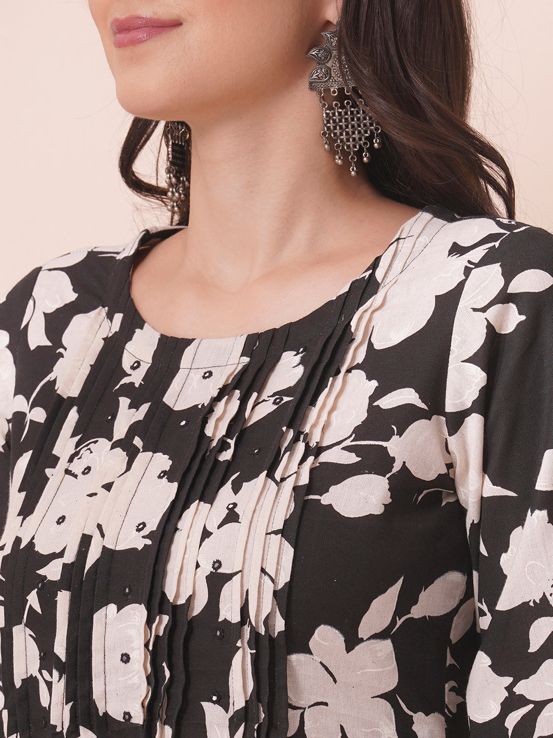 Straight printed kurta with tucks in front with handwork mirrors and elasticated sleeves.