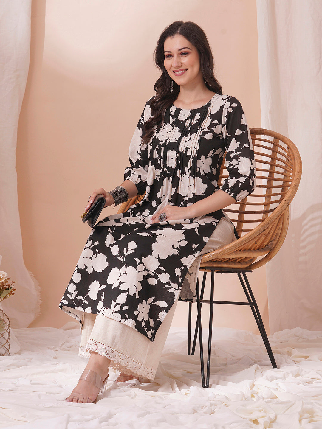 Straight printed kurta with tucks in front with handwork mirrors and elasticated sleeves.