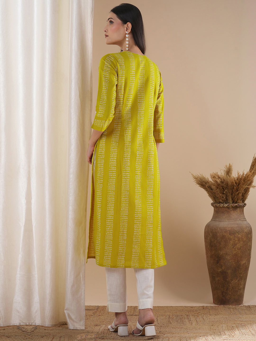 Straight fit kurta with a broad mirror work placket and tucks between stripes and broad sleeve cuff