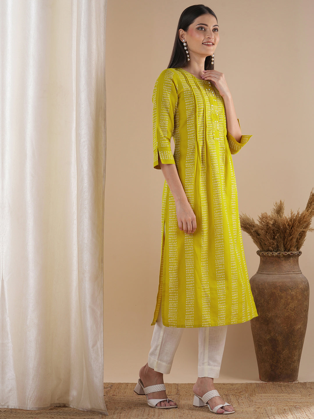 Straight fit kurta with a broad mirror work placket and tucks between stripes and broad sleeve cuff