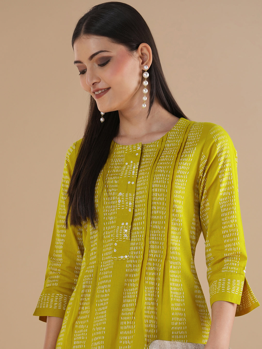 Straight fit kurta with a broad mirror work placket and tucks between stripes and broad sleeve cuff