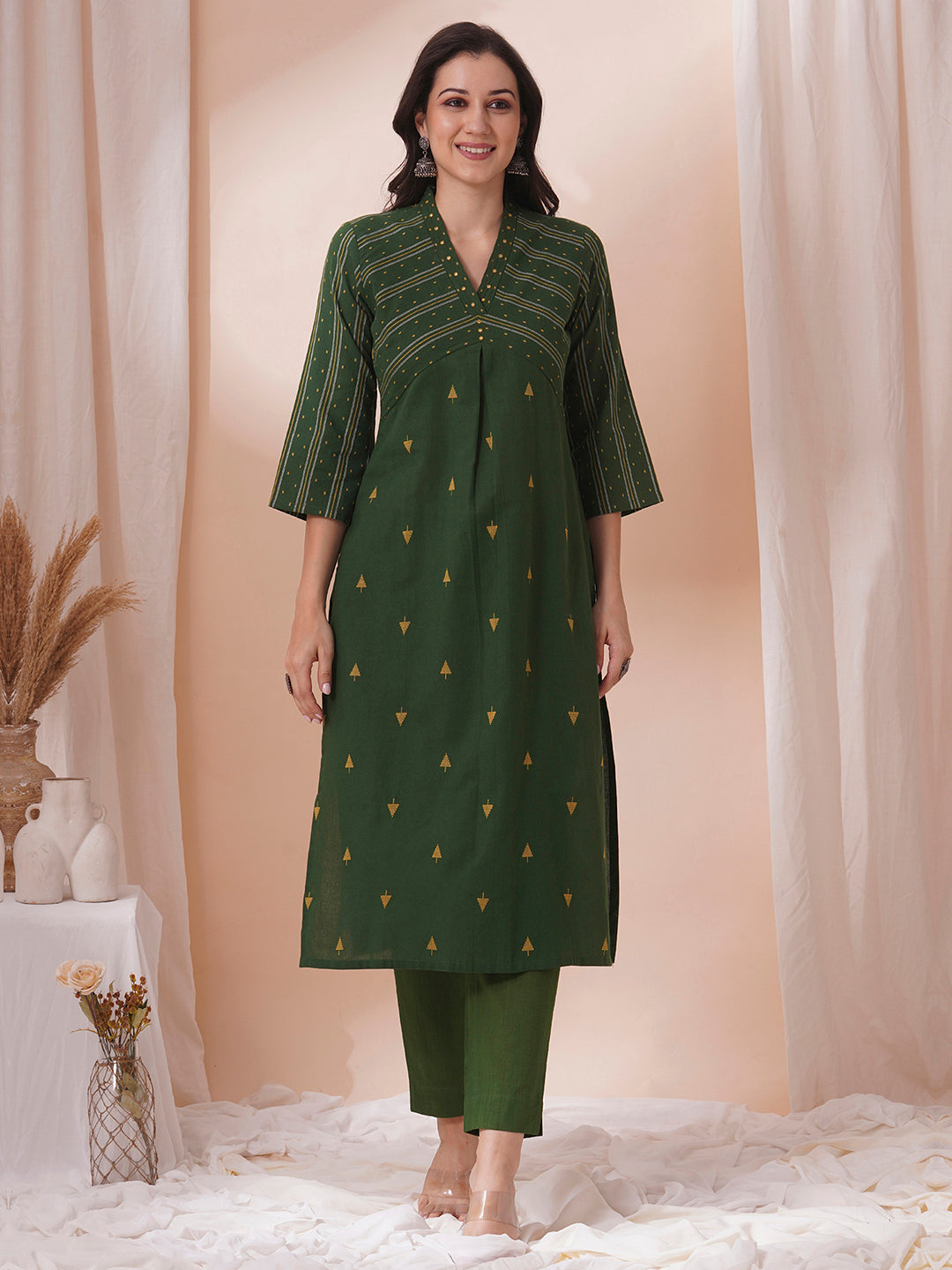 A centre pleated straight fit kurta in complimenting dobby fabric with mirror work.