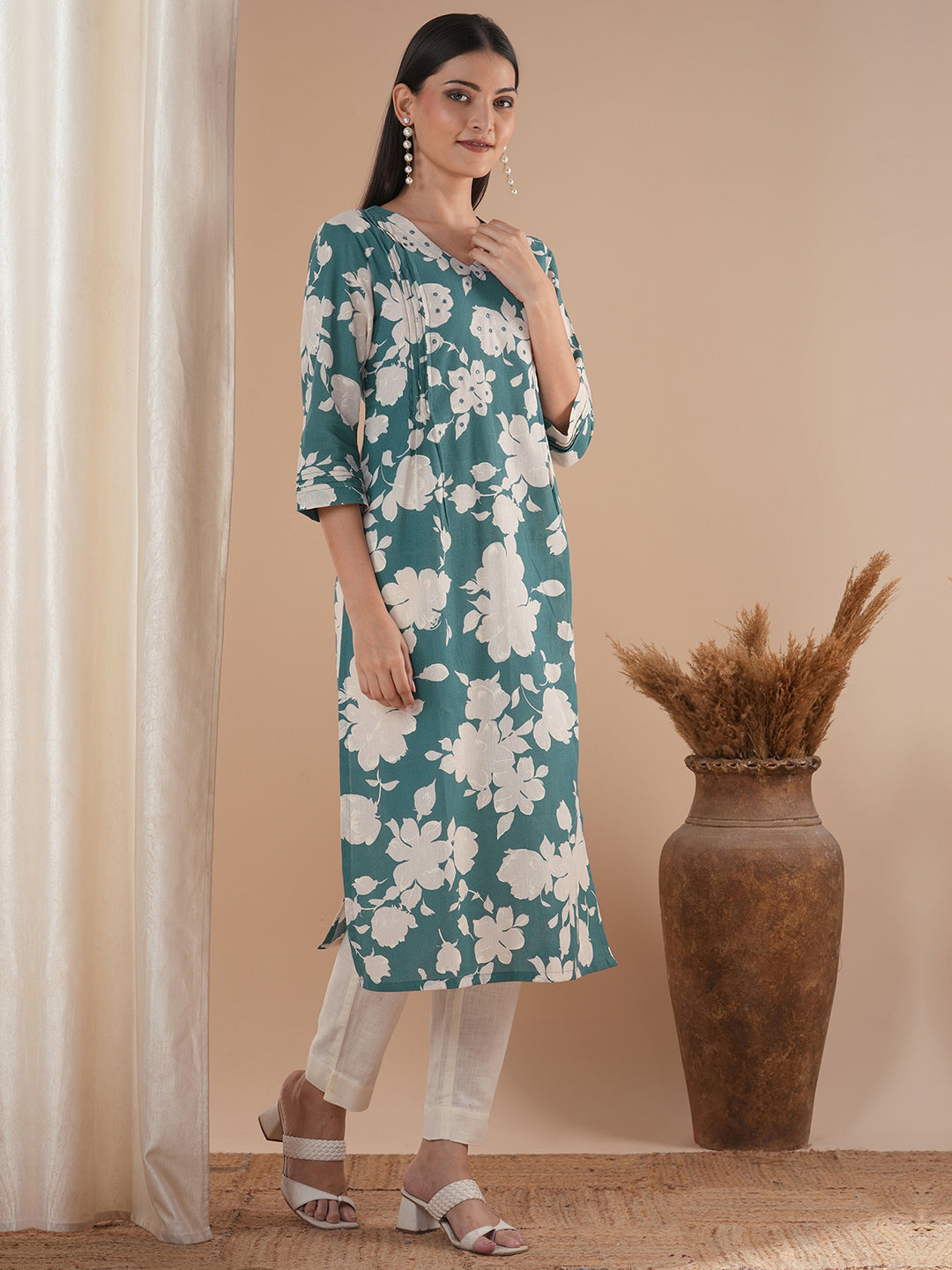 Straight floral printed kurta with tucks on the shoulder and sleeves
