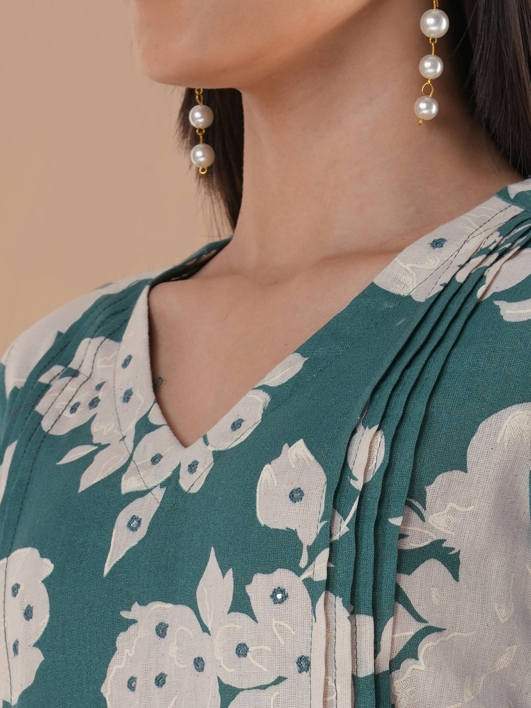 Straight floral printed kurta with tucks on the shoulder and sleeves