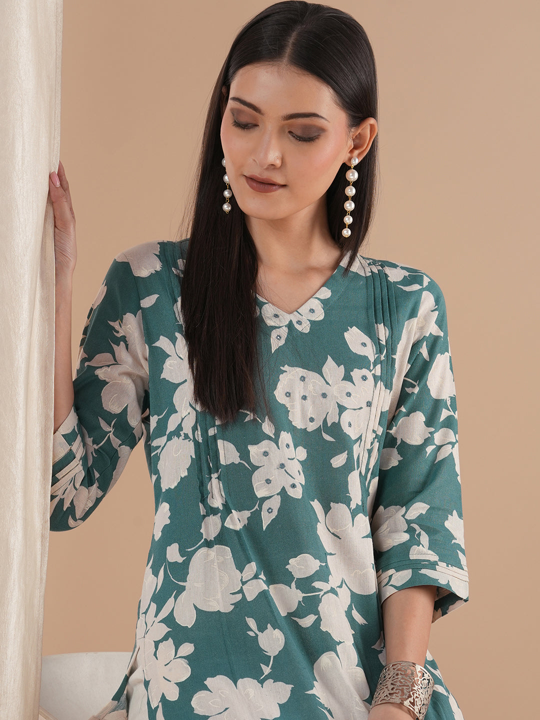 Straight floral printed kurta with tucks on the shoulder and sleeves