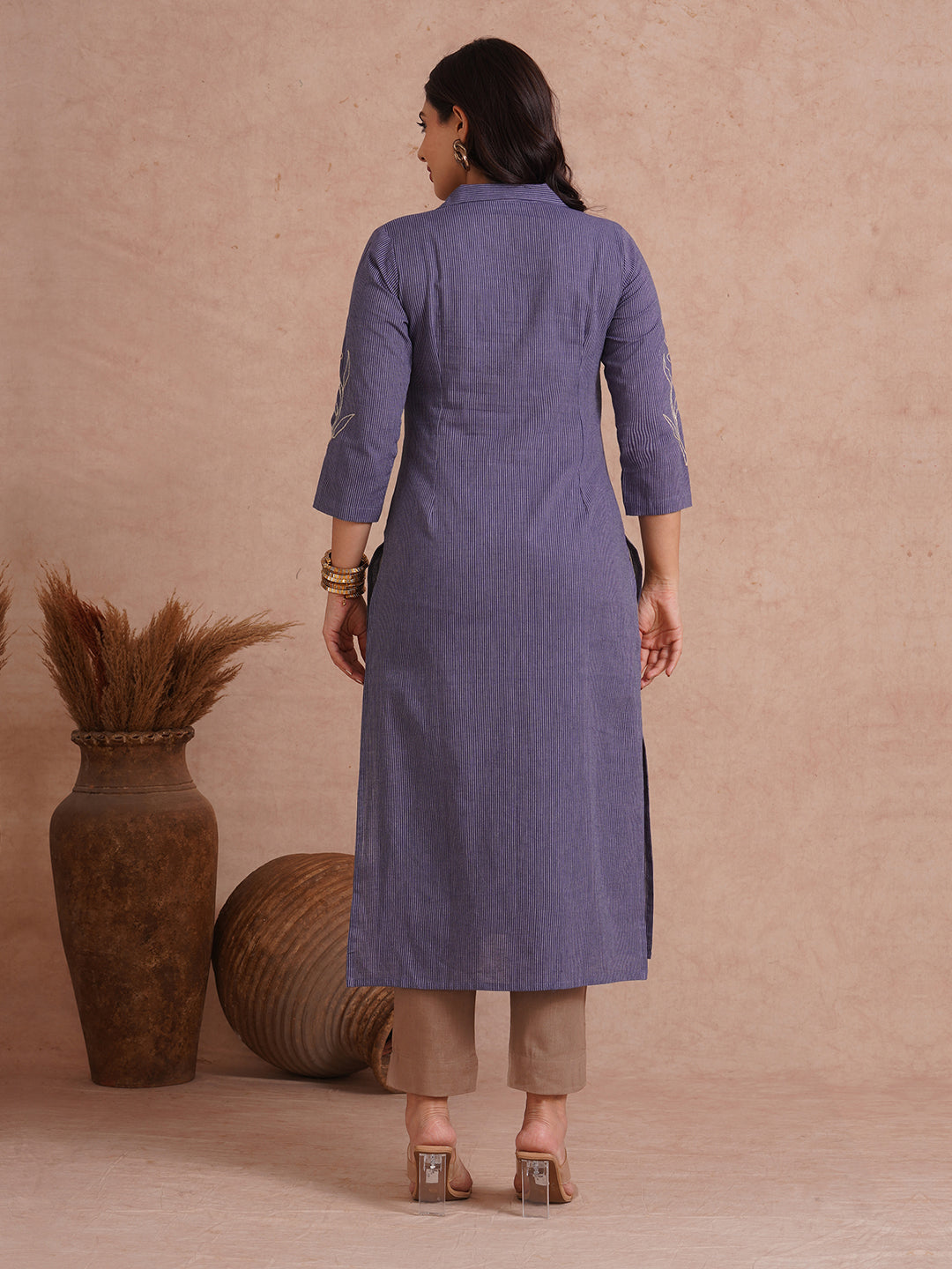 Straight fit collared kurta with placement cord work embroidery with hand sequins.