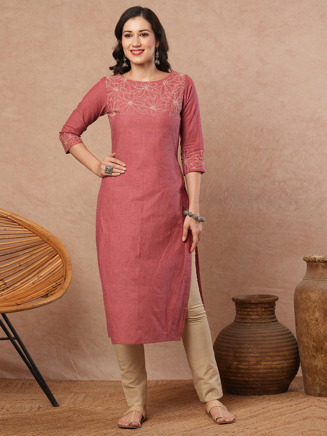 Straight fit kurta with cord work embroidery on the neckline and sleeve.