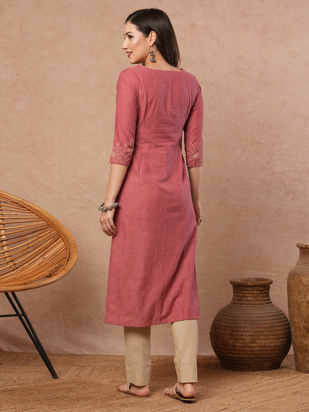 Straight fit kurta with cord work embroidery on the neckline and sleeve.
