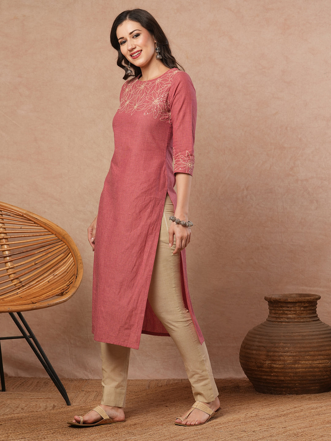 Straight fit kurta with cord work embroidery on the neckline and sleeve.