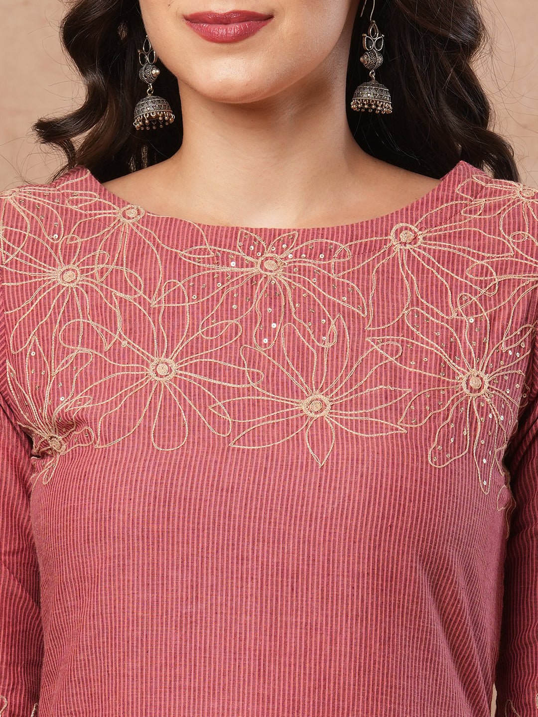 Straight fit kurta with cord work embroidery on the neckline and sleeve.