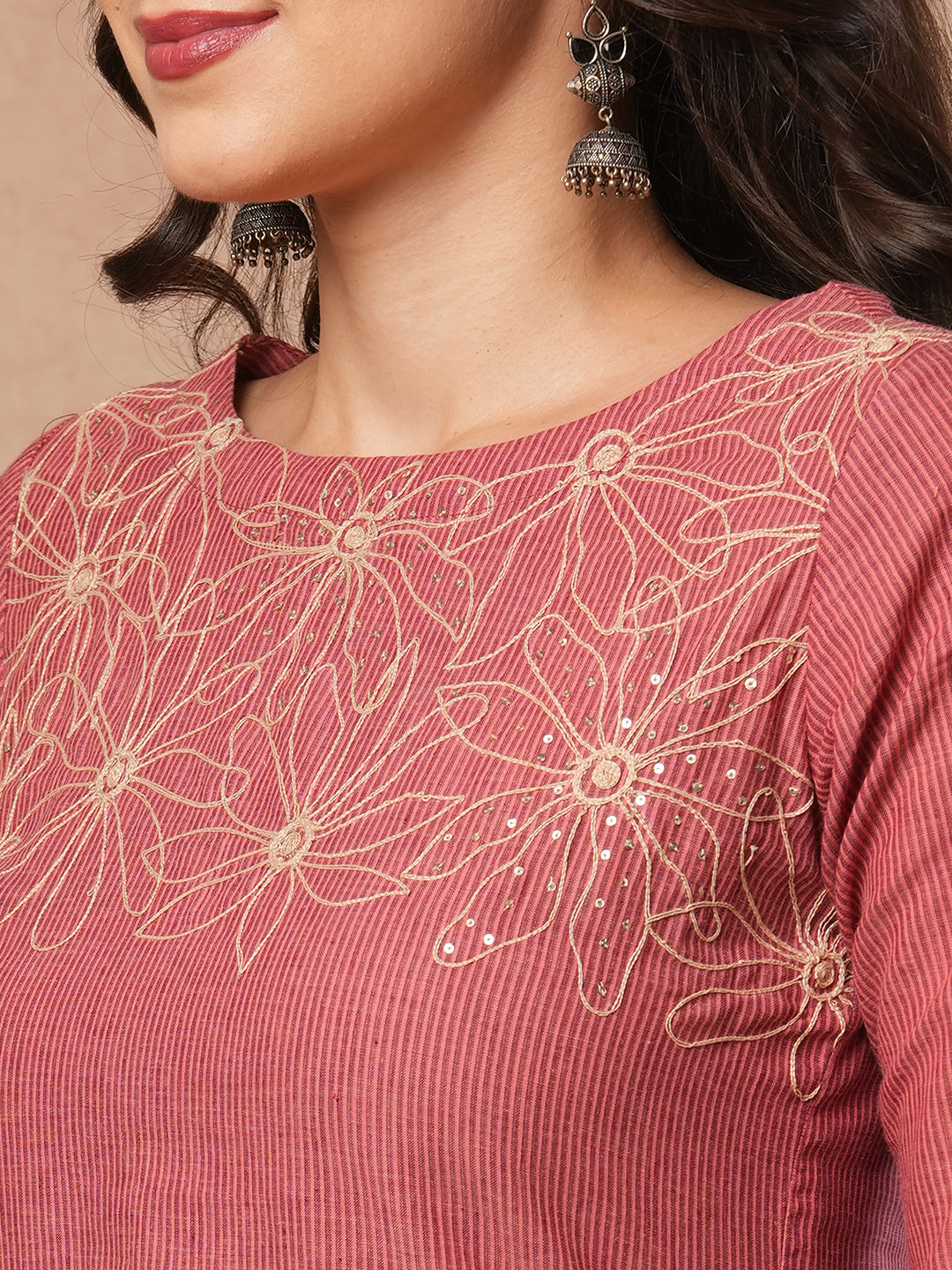 Straight fit kurta with cord work embroidery on the neckline and sleeve.