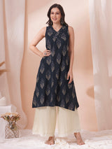 A centre box pleated sleeveless kurta with mirrorwork detailing on the neck.