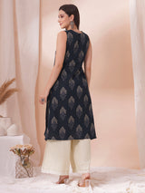 A centre box pleated sleeveless kurta with mirrorwork detailing on the neck.