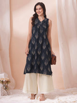 A centre box pleated sleeveless kurta with mirrorwork detailing on the neck.