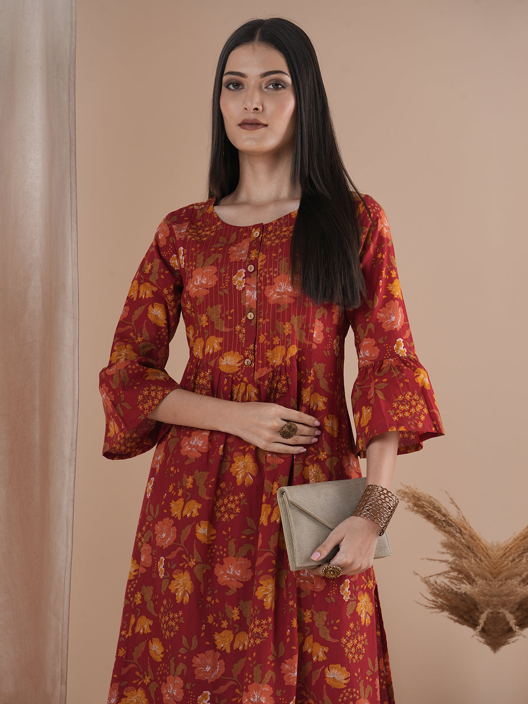 A printed shoulder princess A-line kurta with stitch lines on the shaped yoke and bell sleeves