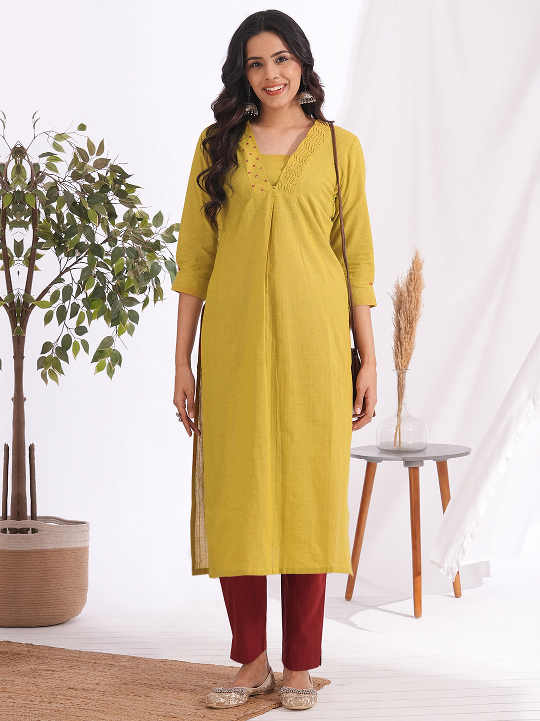 Straight fit kurta with smocking and mirrorwork neckline, shaped waistline with centre box pleat
