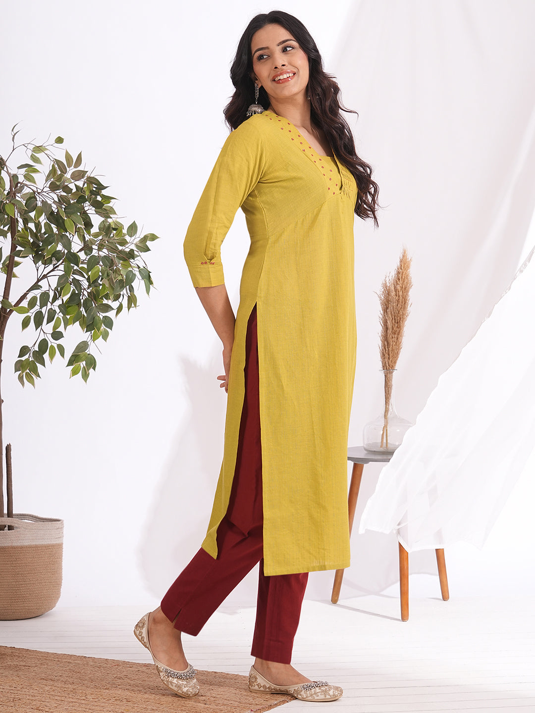 Straight fit kurta with smocking and mirrorwork neckline, shaped waistline with centre box pleat