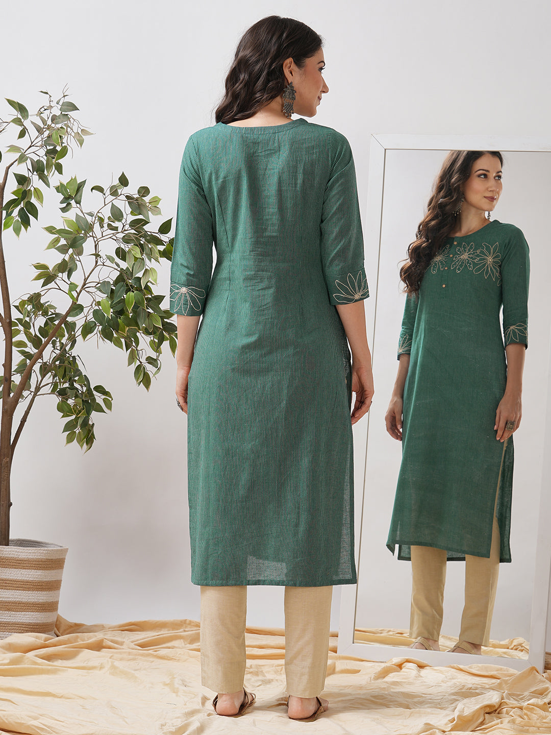 Straight fit kurta with cord work embroidery on the neck and cuff highlighted with sequins.