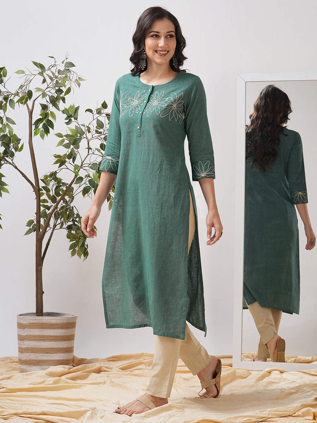 Straight fit kurta with cord work embroidery on the neck and cuff highlighted with sequins.