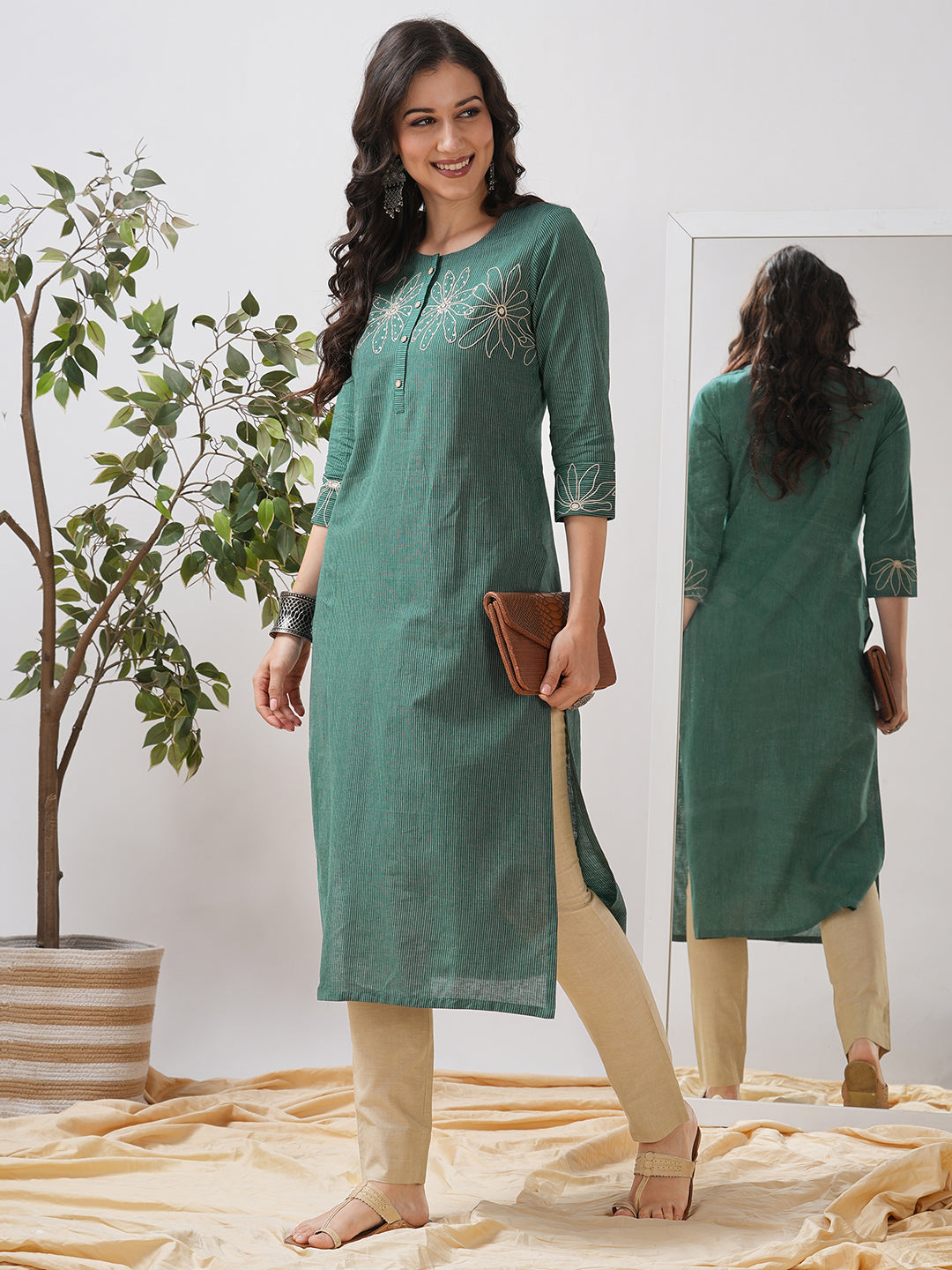 Straight fit kurta with cord work embroidery on the neck and cuff highlighted with sequins.