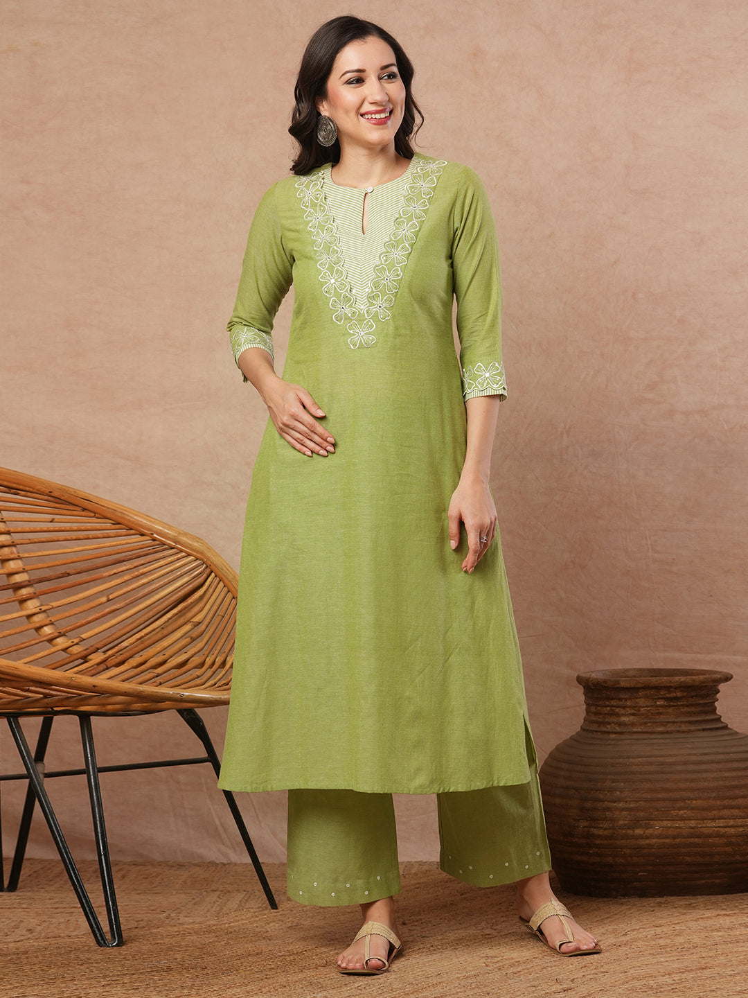 A-line kurta with cutwork embroidery neckline and sleeves and metered stripe yoke.