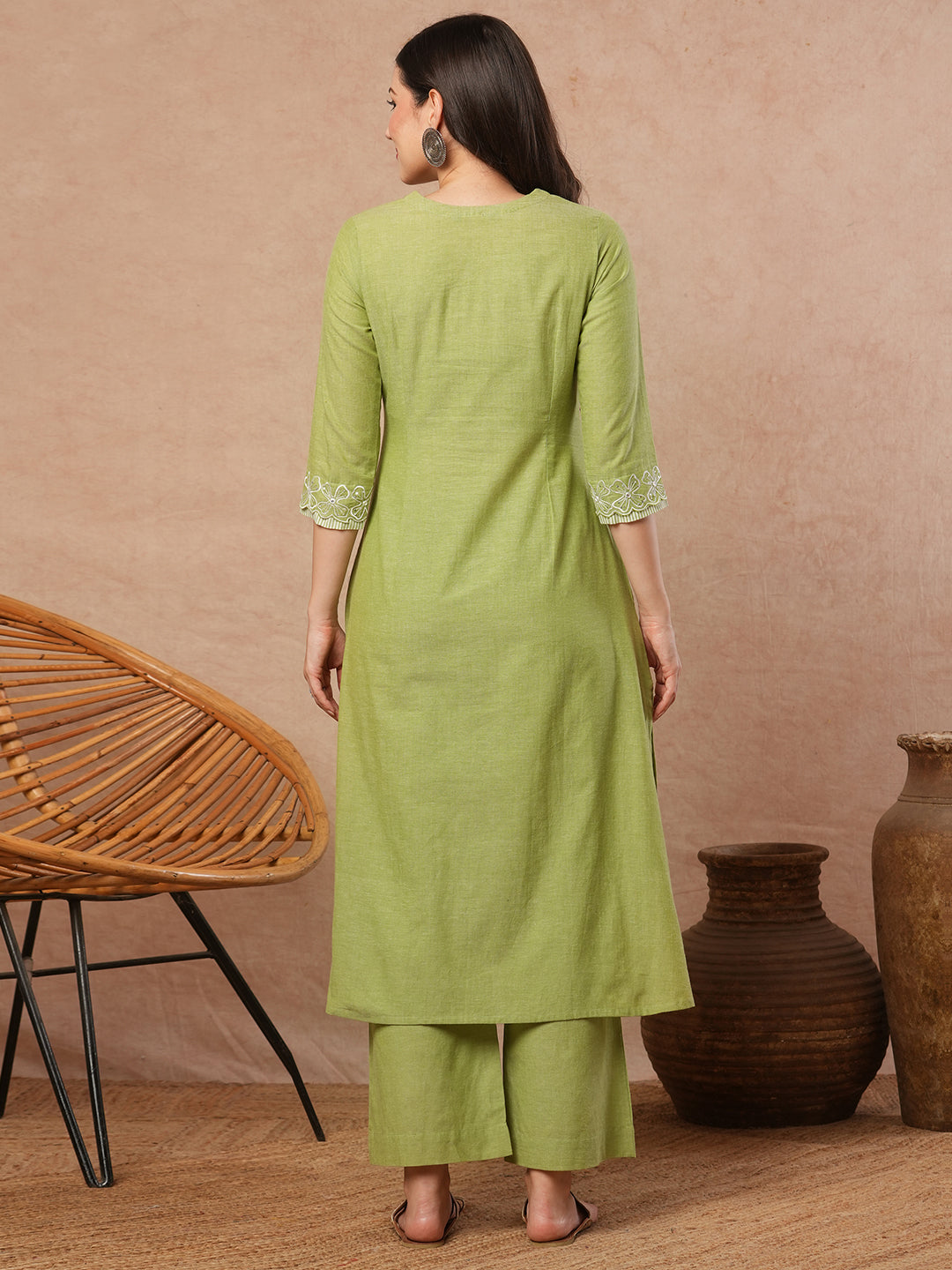 A-line kurta with cutwork embroidery neckline and sleeves and metered stripe yoke.