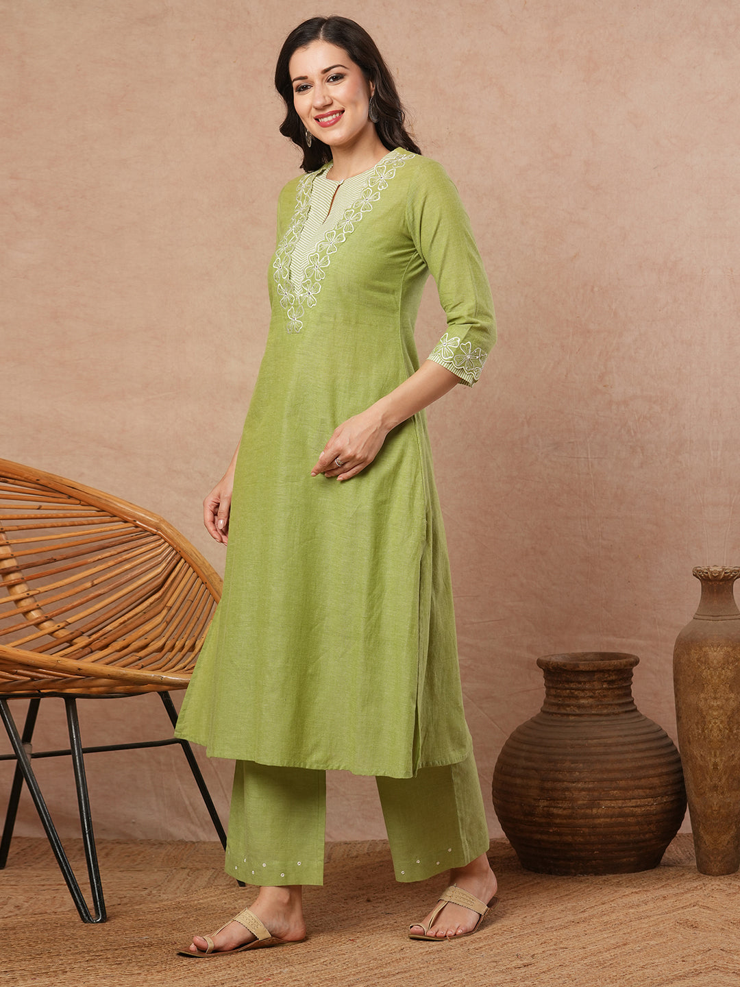 A-line kurta with cutwork embroidery neckline and sleeves and metered stripe yoke.