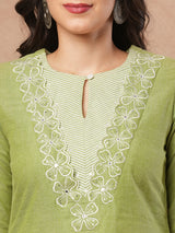 A-line kurta with cutwork embroidery neckline and sleeves and metered stripe yoke.