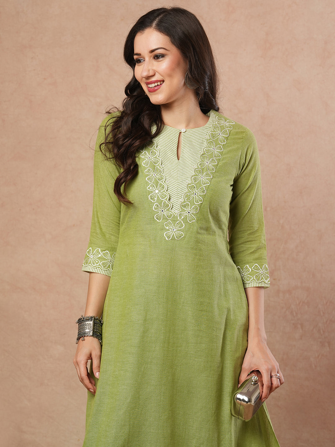 A-line kurta with cutwork embroidery neckline and sleeves and metered stripe yoke.
