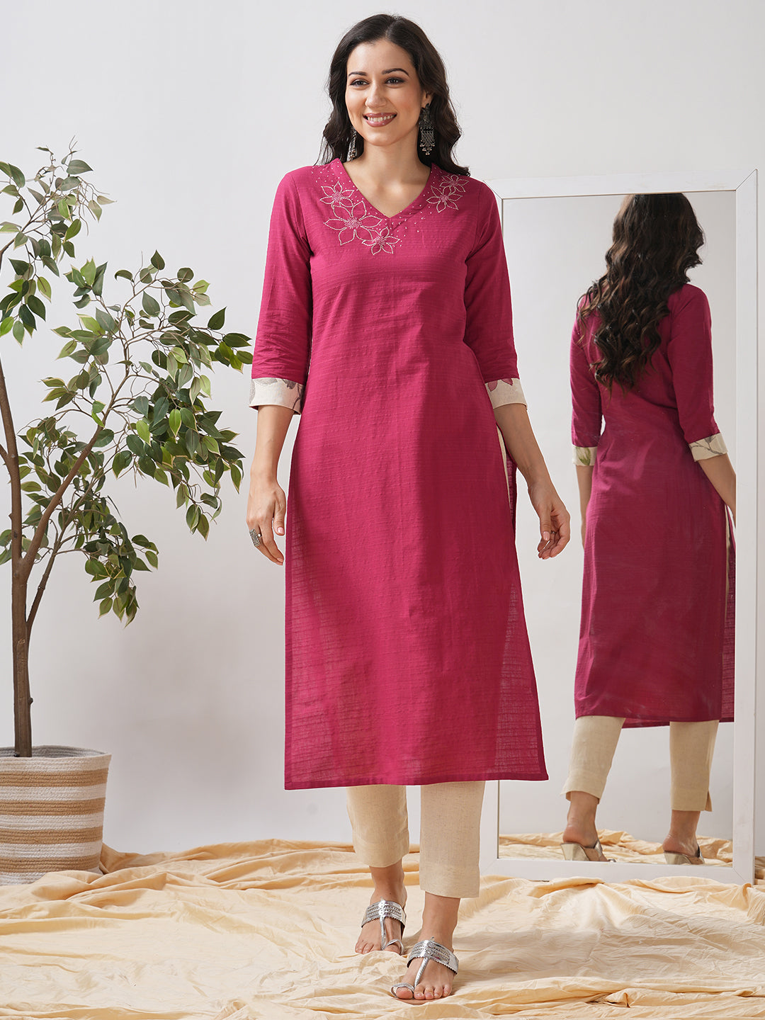 Straight fit kurta with embroidered neckline and contrast print roll-up cuff.
