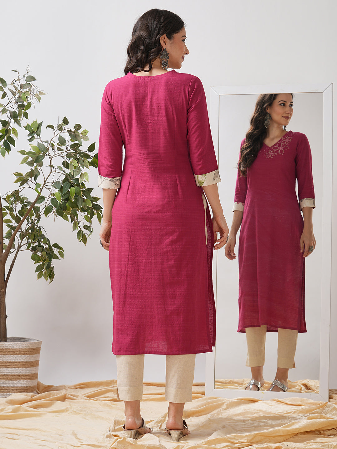 Straight fit kurta with embroidered neckline and contrast print roll-up cuff.