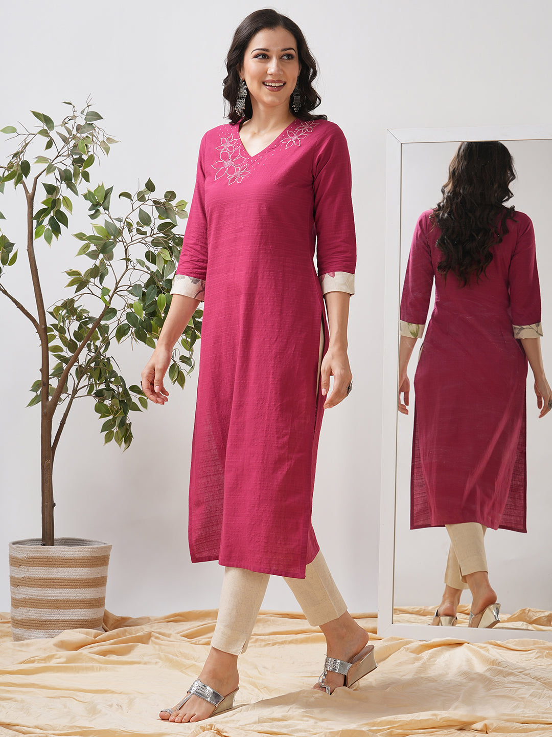 Straight fit kurta with embroidered neckline and contrast print roll-up cuff.