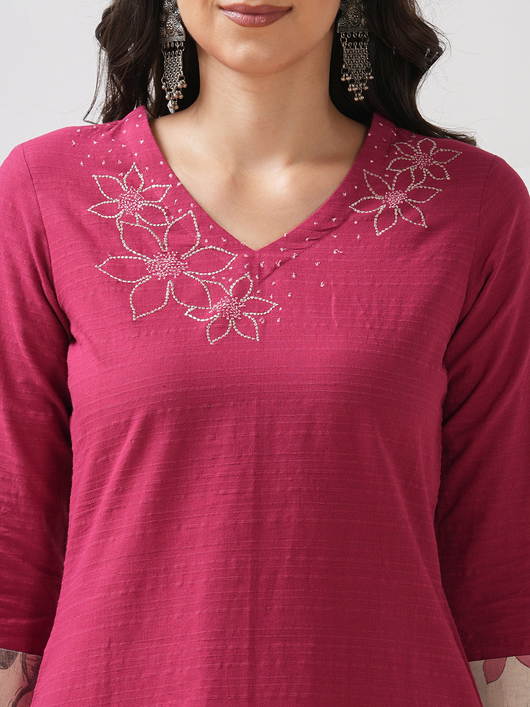 Straight fit kurta with embroidered neckline and contrast print roll-up cuff.