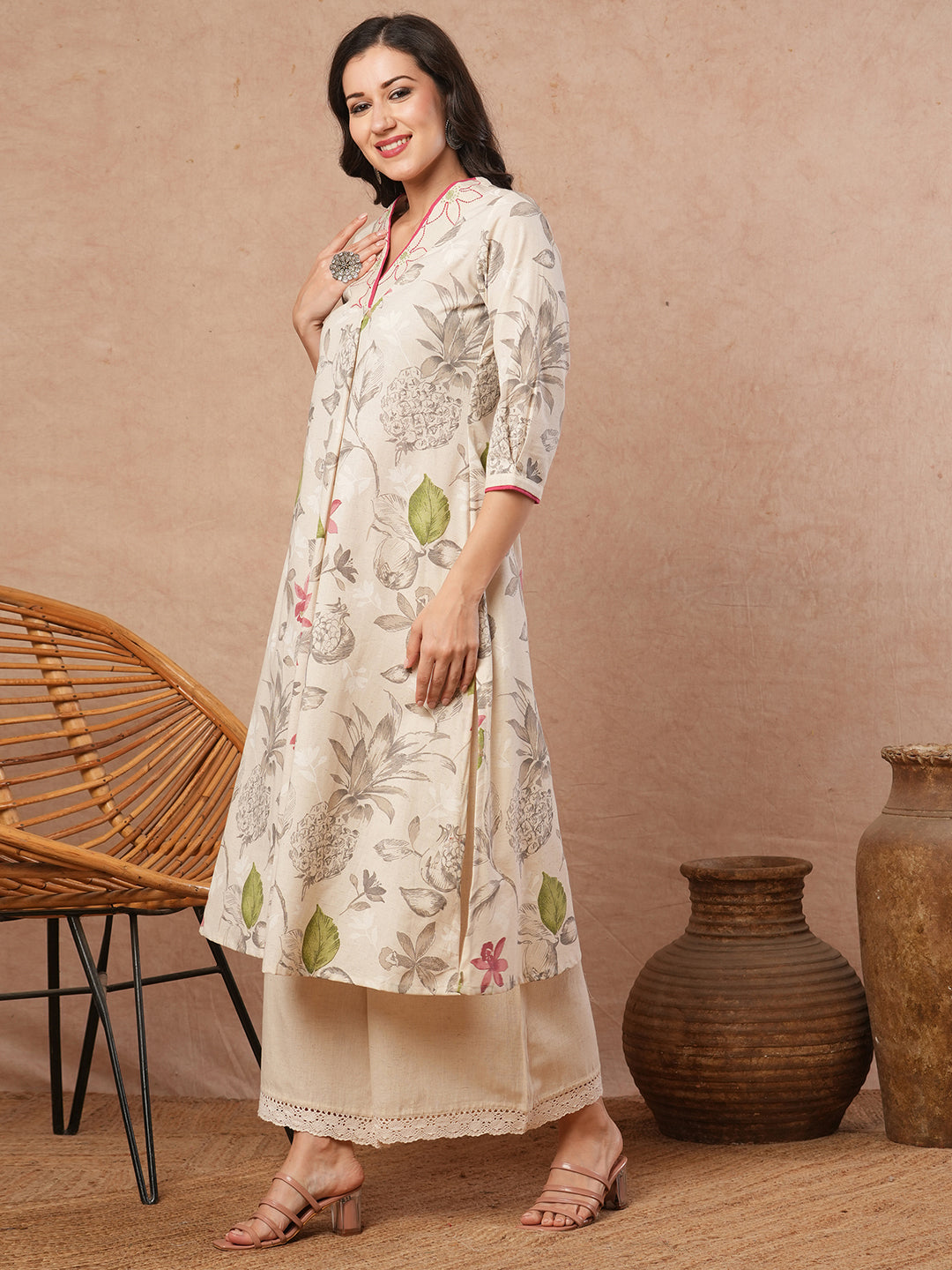 A-line printed kurta with embroidery and box pleated sleeves with contrast piping detailing.