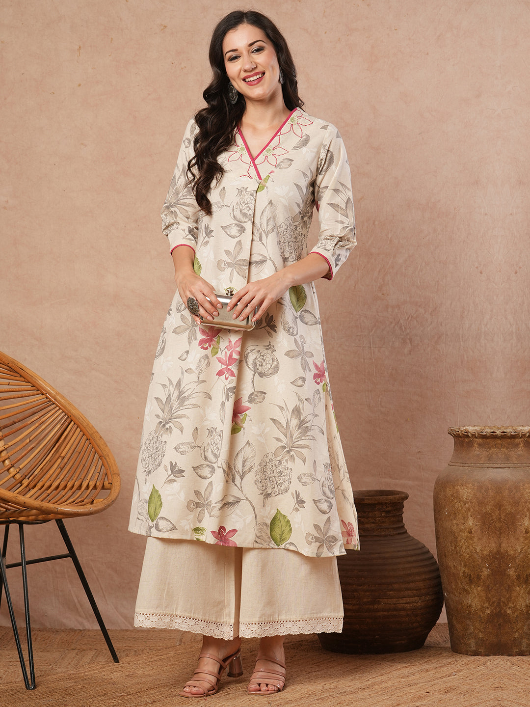 A-line printed kurta with embroidery and box pleated sleeves with contrast piping detailing.