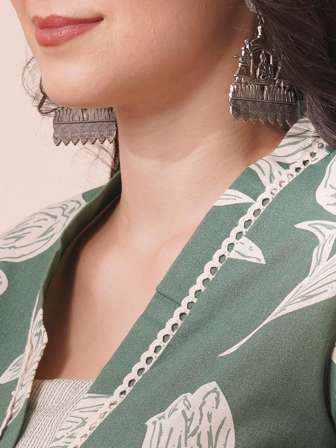 A flex printed A-line kurta with stitch line and lace detailing.