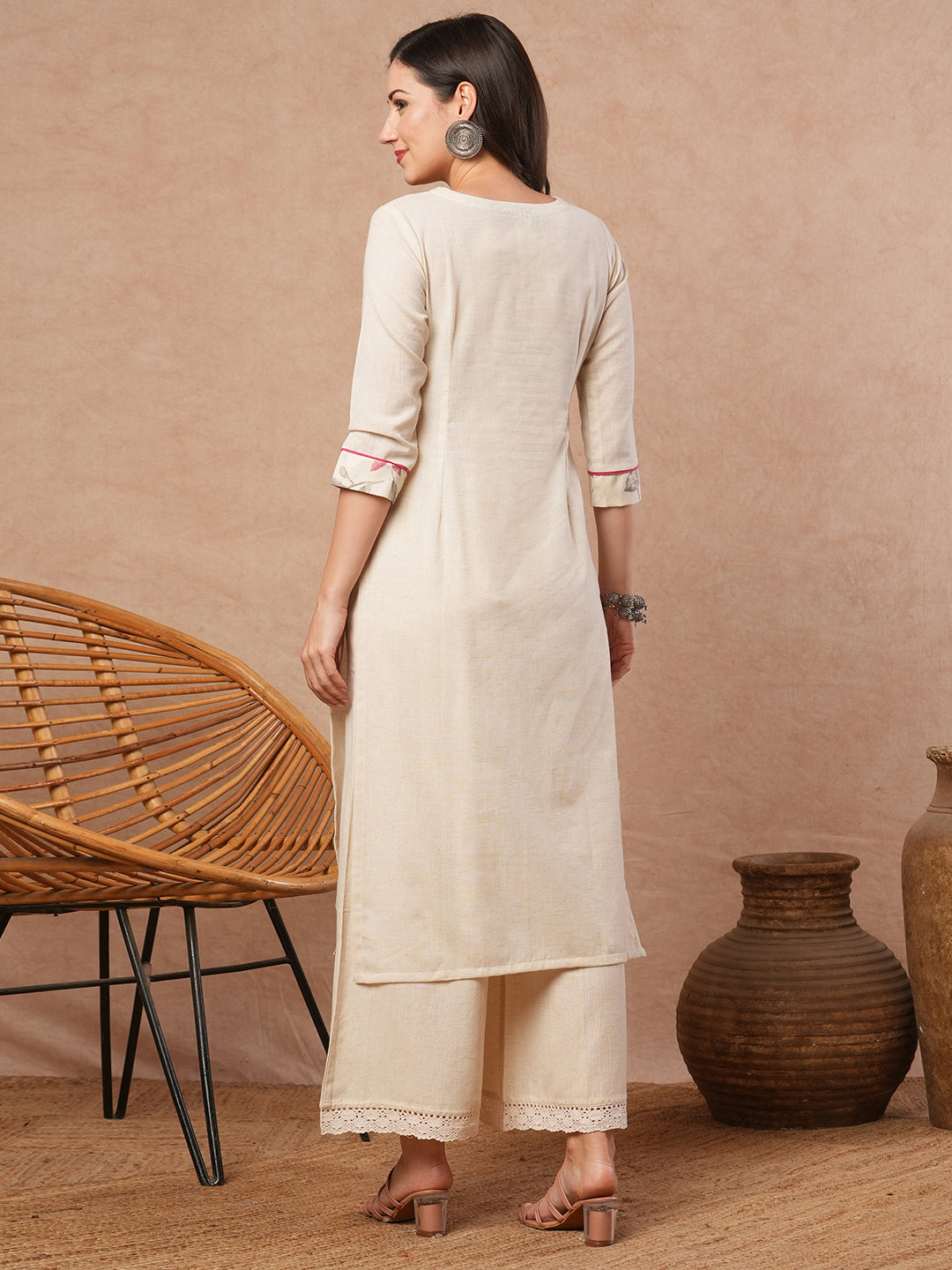 Straight fit solid kurta with a wrap half embroidered and half printed yoke.