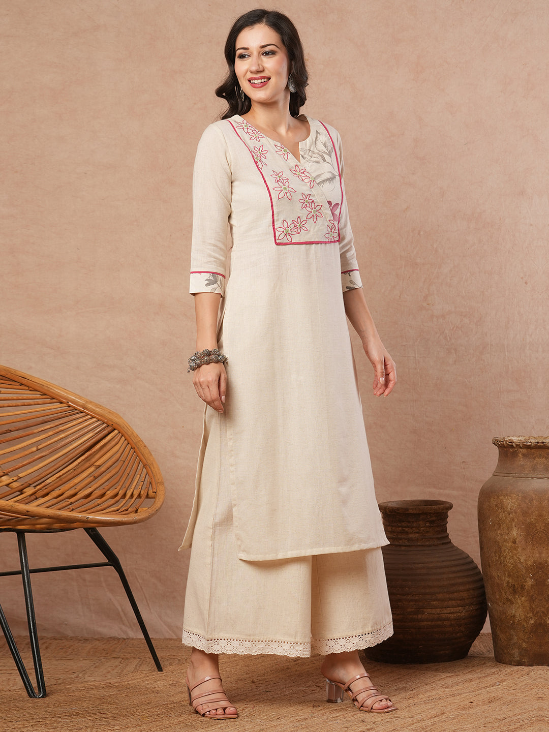Straight fit solid kurta with a wrap half embroidered and half printed yoke.