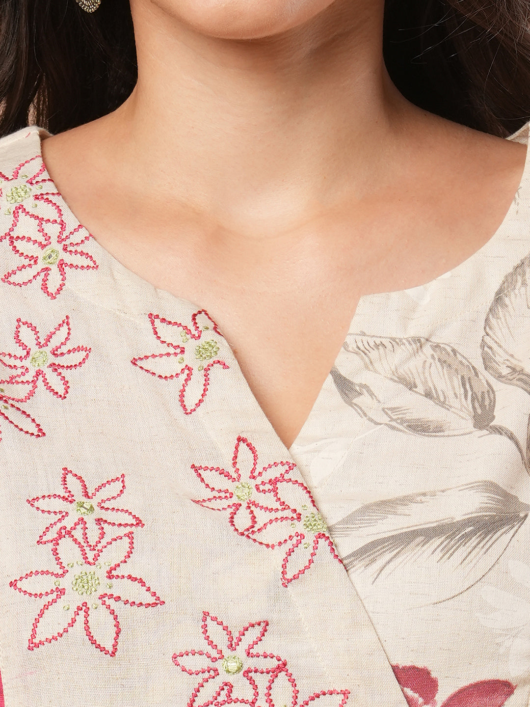 Straight fit solid kurta with a wrap half embroidered and half printed yoke.