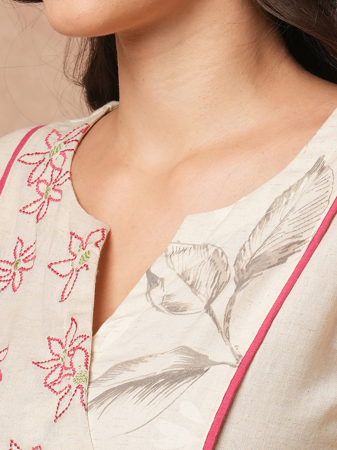 Straight fit solid kurta with a wrap half embroidered and half printed yoke.