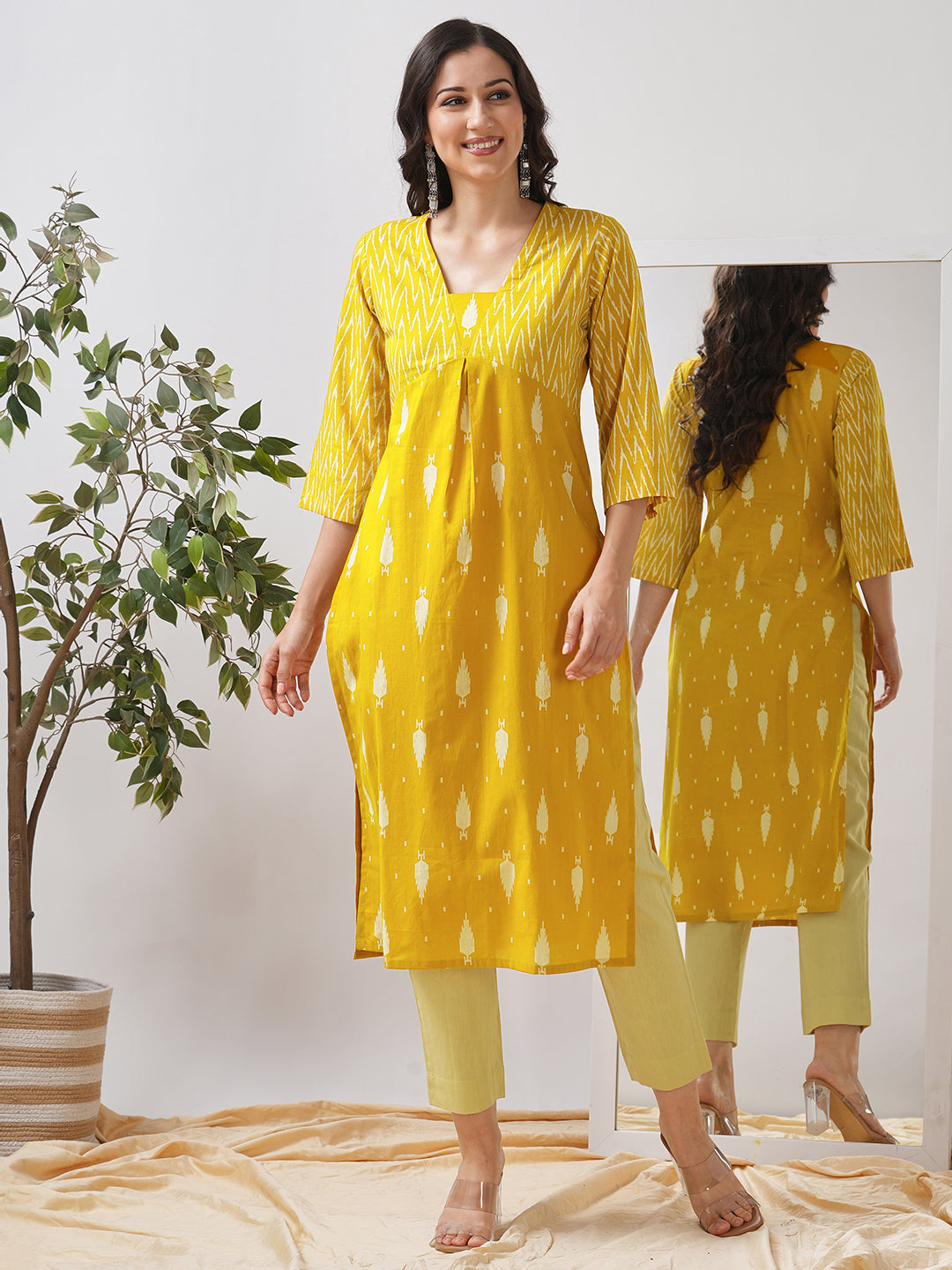 Straight fit shaped waist kurta with coordinated print yoke and bell sleeves.