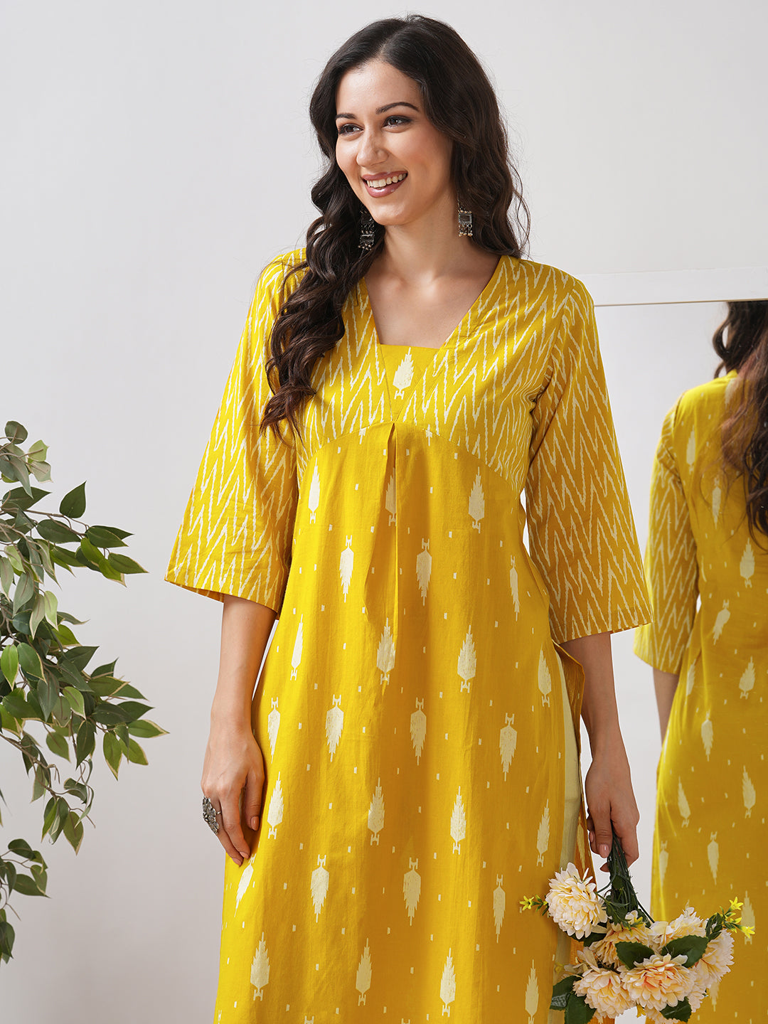 Straight fit shaped waist kurta with coordinated print yoke and bell sleeves.