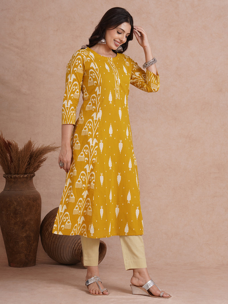 A-Line shoulder princess kurta with coordinating prints and handwork around placket.