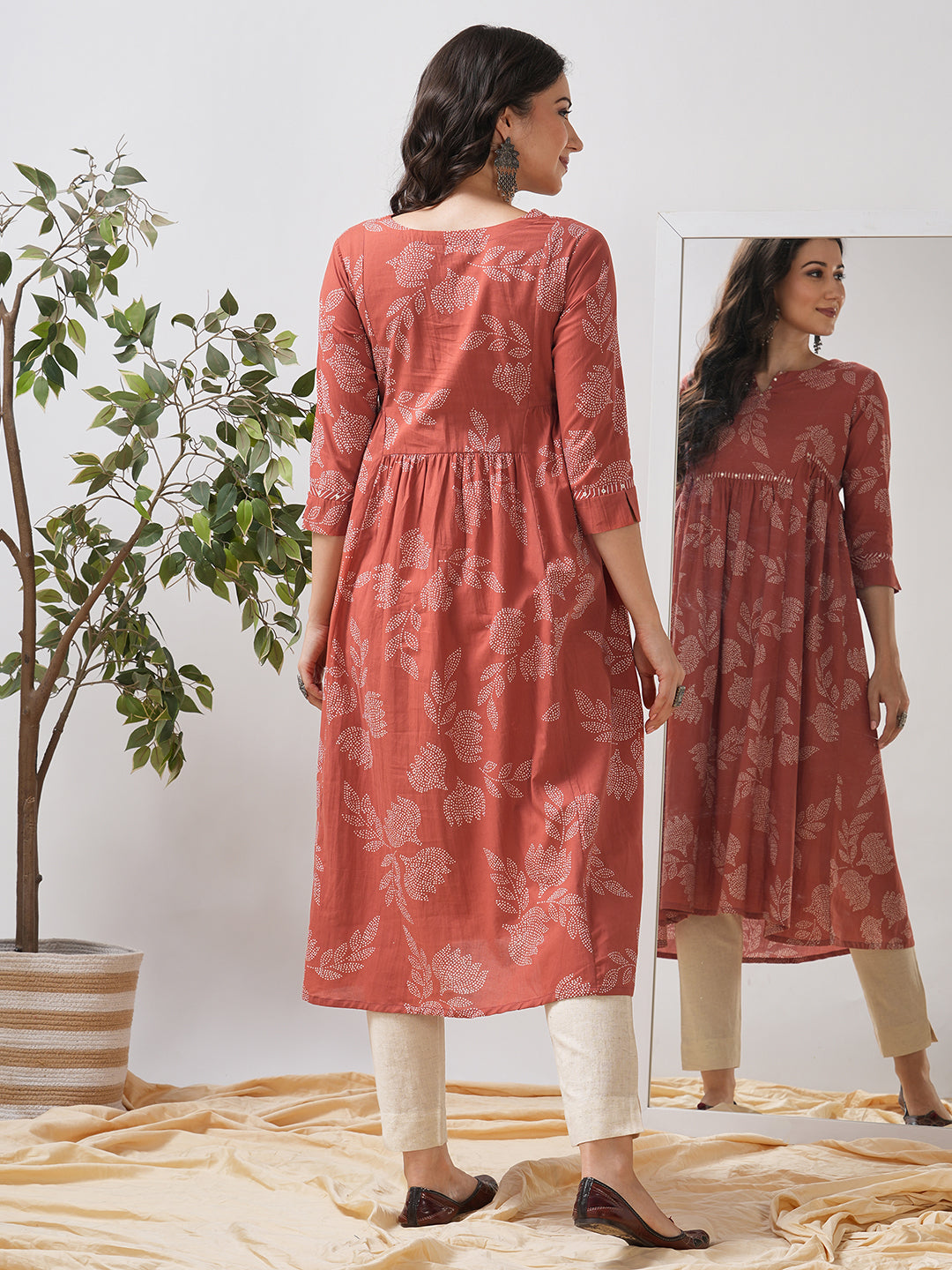 Printed flared kurta with layered waist gathers and trim detailing with handwork mirrors.
