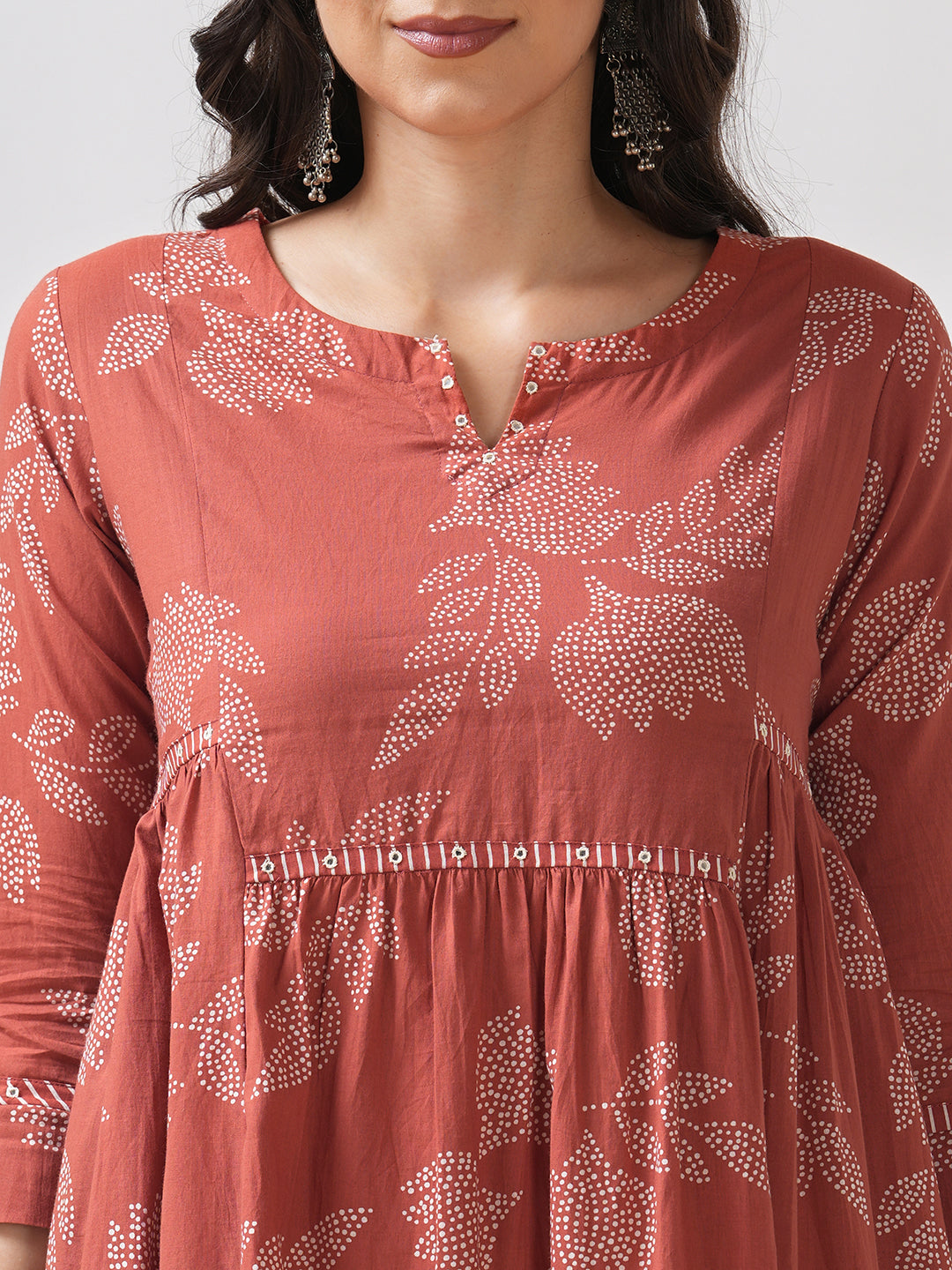 Printed flared kurta with layered waist gathers and trim detailing with handwork mirrors.