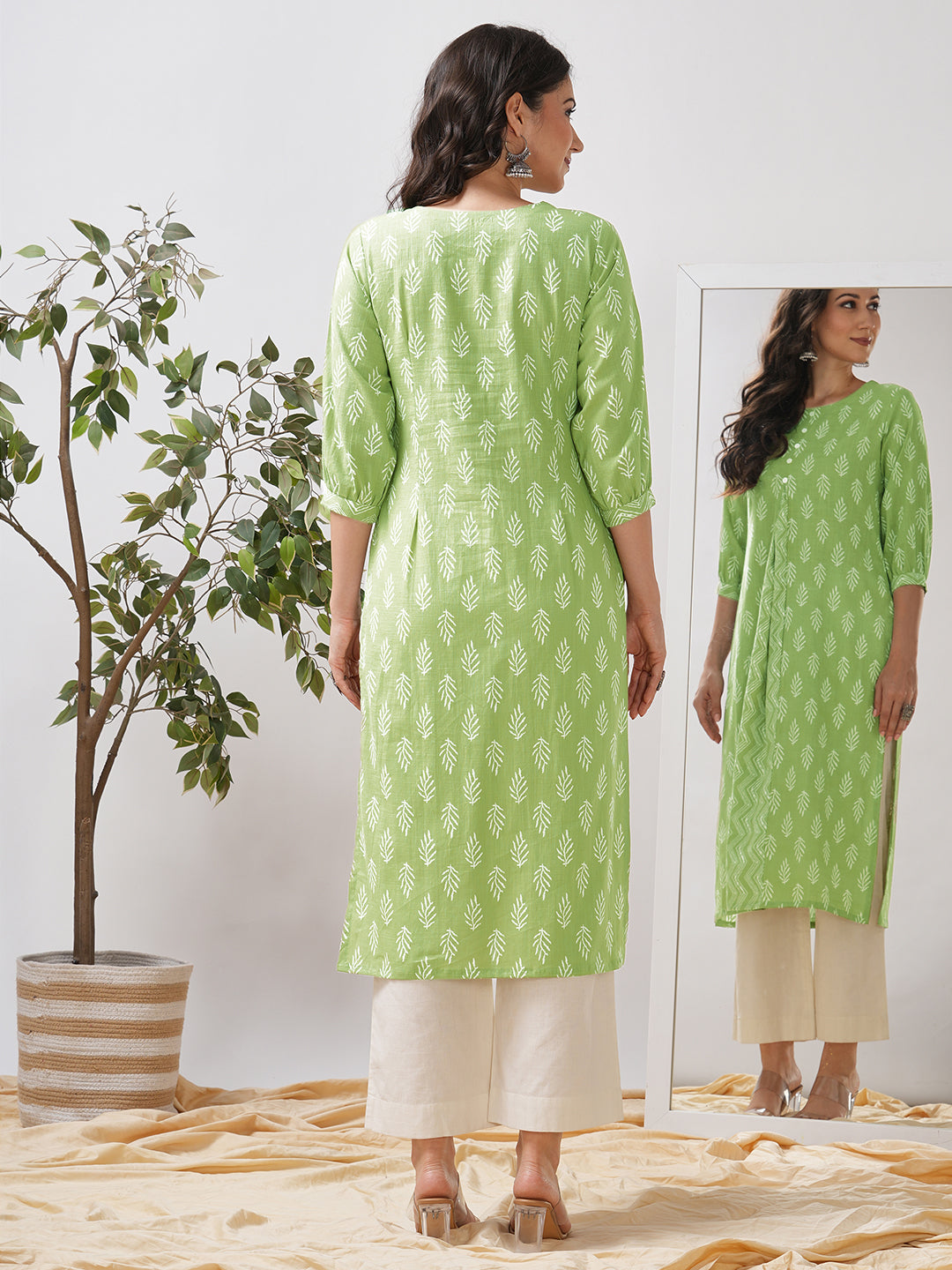 Straight fit kurta with cut and sew trim fabric centre pleat and gathered sleeves.