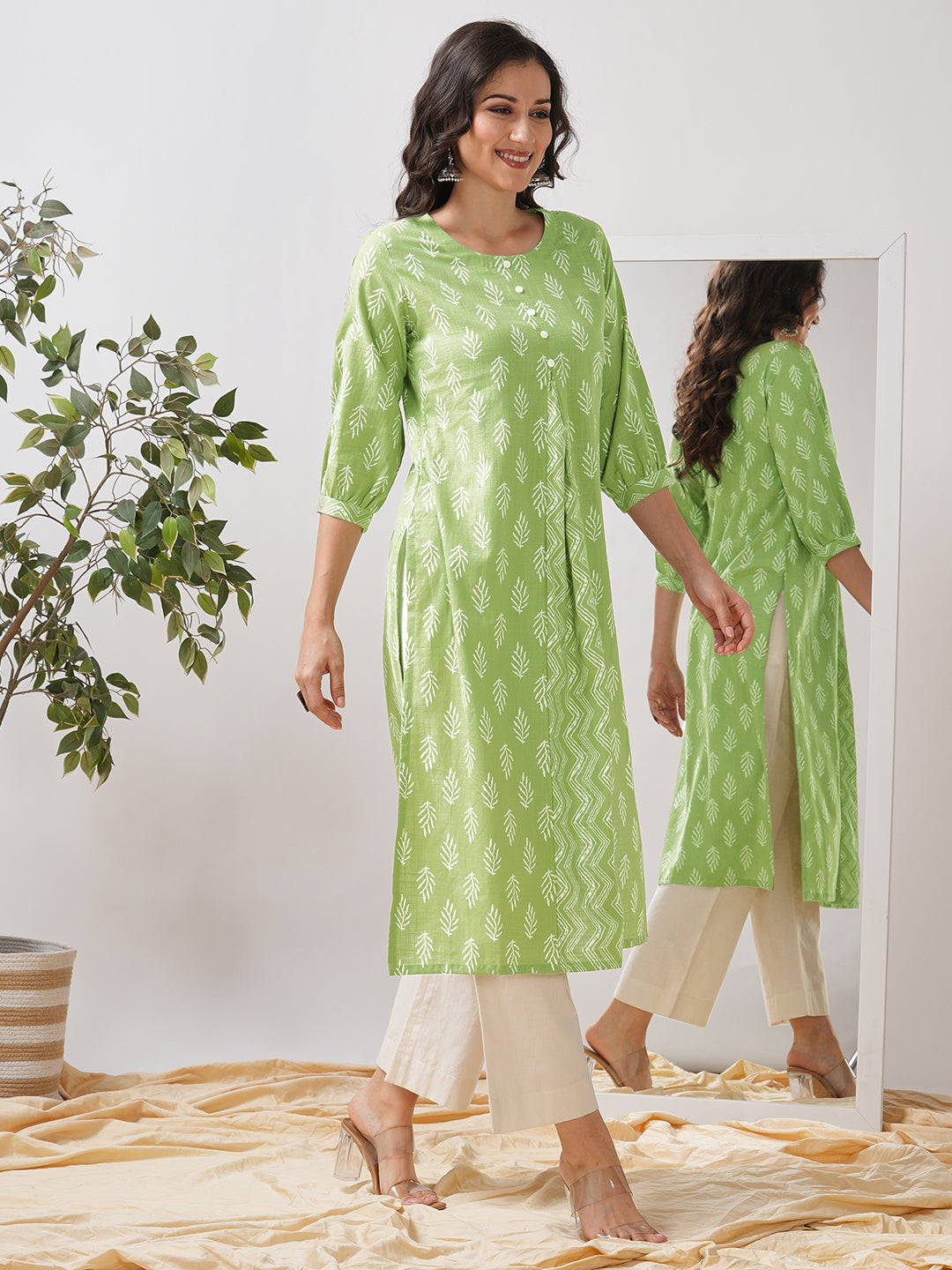 Straight fit kurta with cut and sew trim fabric centre pleat and gathered sleeves.