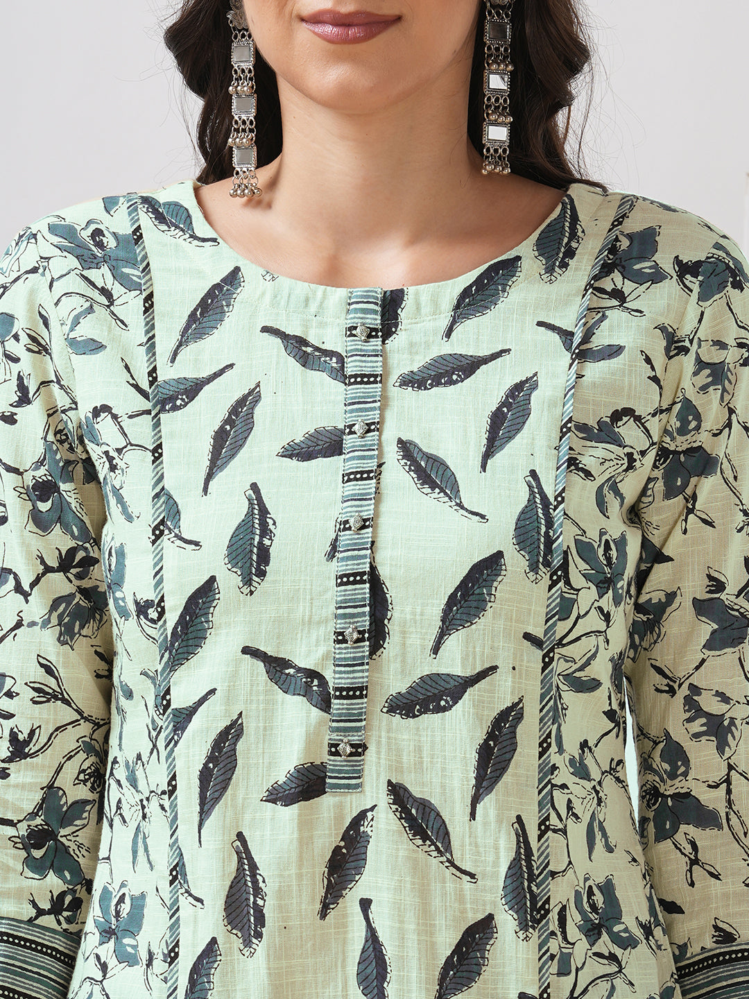 Straight fit shoulder princess kurta with piping between the seams and placket.